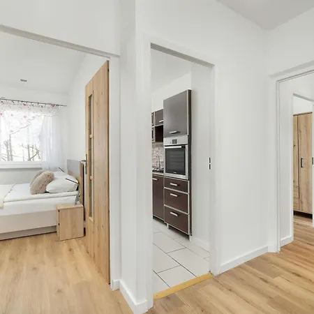 Jasny Apartament z Balkonem by Noclegi Renters Apartament Kołobrzeg